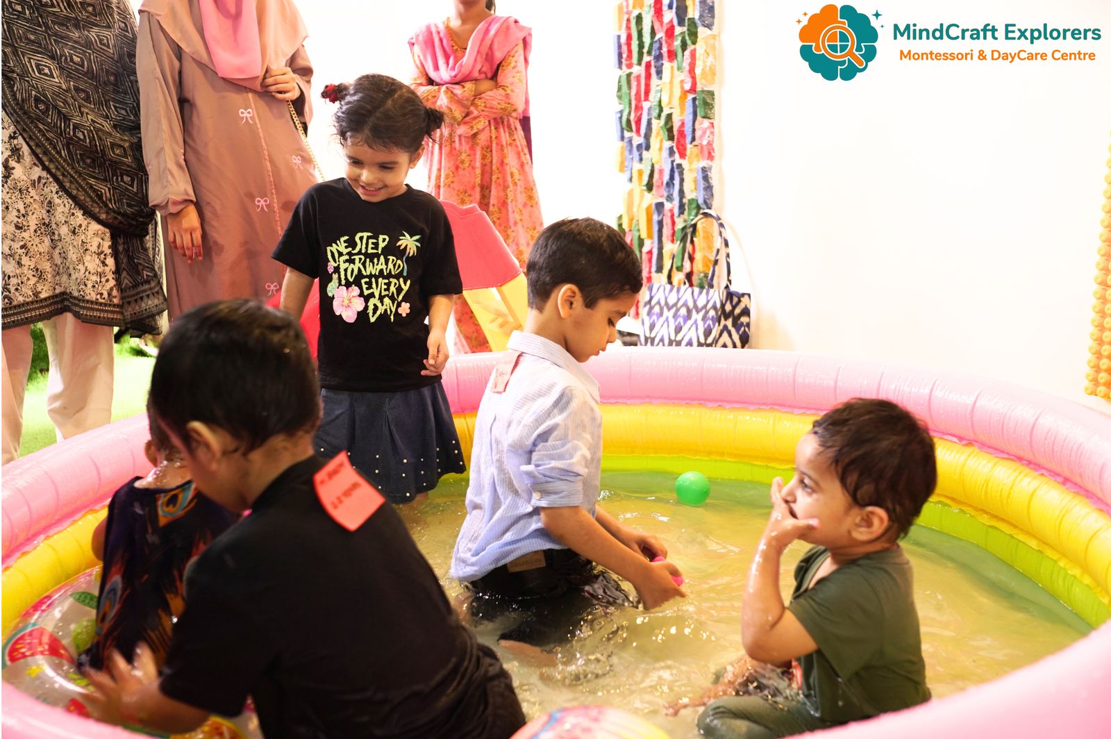 Children playing in an indoor paddling pool