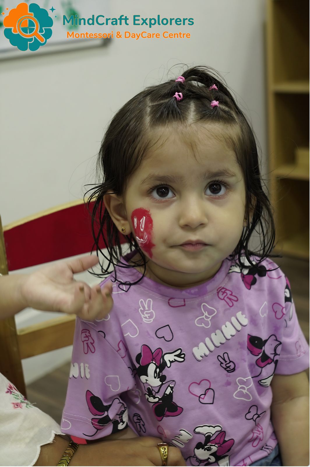 A little girl with a painted flag on her cheek